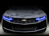 Front end of a Chevrolet Camaro with blue headlight DRLs.