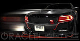 Front end of a black Dodge Charger with red headlight DRLs.