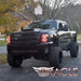Three quarters view of a Chevrolet Silverado with amber LED headlight halo rings installed.