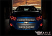 Front view of a Chevrolet Sonic with red LED headlight and fog light halo rings installed.