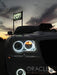 Close-up of white LED headlight and fog light halo rings installed on a Chrysler 300.