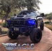 Front view of a black Dodge Ram with blue LED headlight halo rings.