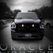 Front end of a black Dodge Ram with white LED headlight halo rings installed.