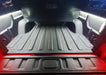 Truck bed with LED cargo light strips installed