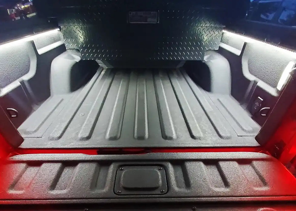 Truck bed with LED cargo light strips installed