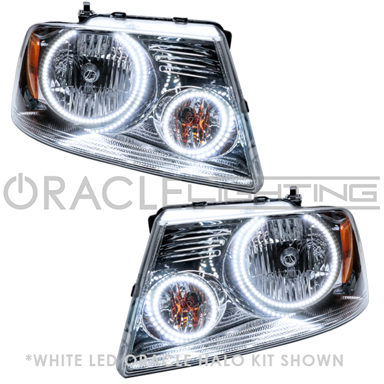 Ford F-150 headlights with white LED halo rings.