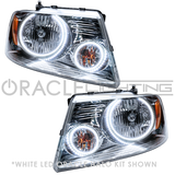 Ford F-150 headlights with white LED halo rings.