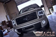 Front view of a Ford F-150 with white LED headlight and fog light halos.