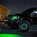 Black and green Ford Raptor with green LED lighting installed.