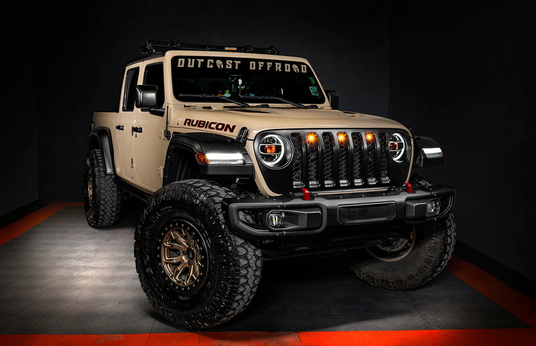 Three quarters view of a Jeep Gladiator JT with amber demon eye projectors.
