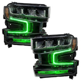 Chevrolet Silverado 1500 headlights with green DRLs.