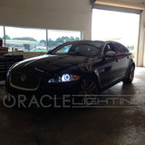 Three quarters view of a Jaguar XJ with white LED headlight halo rings installed.