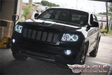 Front end of a Jeep Grand Cherokee with white LED headlight and fog light halos.