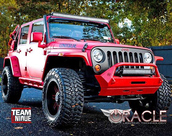 Three quarter view of a Jeep Wrangler JK with Windshield Brackets and Light Combo installed on the roof.