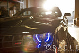 Close-up of a blue LED halo ring installed on a Chevrolet Camaro headlight.