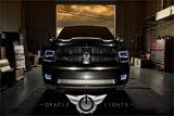 Front end of a dodge Ram with white LED headlight and fog light halo rings.