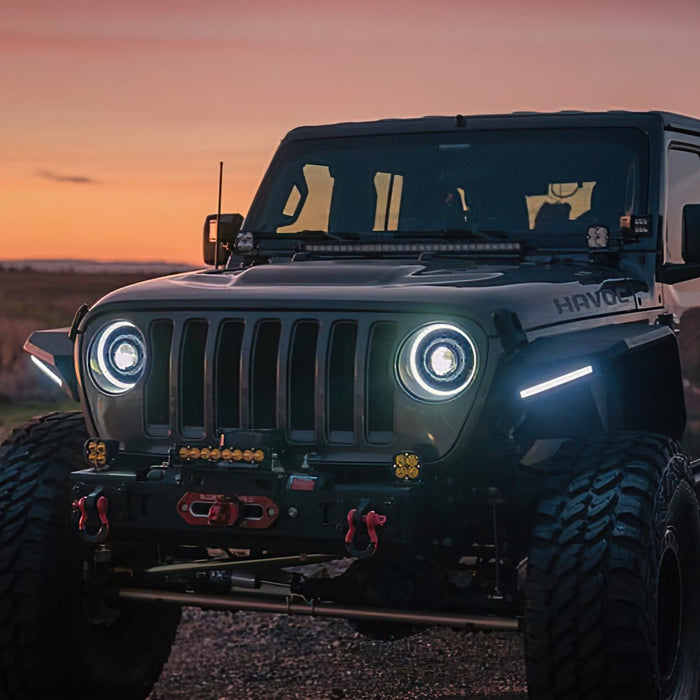 Three quarters view of a Jeep with multiple aftermarket lighting products installed, including Oculus Headlights.