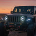 Three quarters view of a Jeep with multiple aftermarket lighting products installed, including Oculus Headlights.
