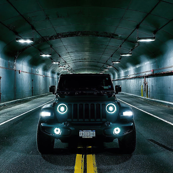 Front view of a Jeep Wrangler lit up with Oculus Headlights.