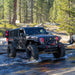 Jeep outdoors in the water with bright red halo headlights