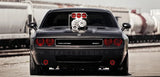 Front view of a grey Dodge Challenger with red LED headlight and fog light halo rings installed.