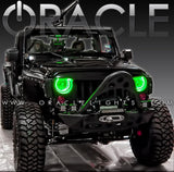 Jeep Wrangler JK with green LED headlight halo rings installed.