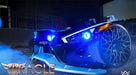 Front end of a Polaris Slingshot with blue headlight halo rings.