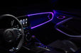 Car interior with purple fiber optic lighting installed on the dashboard.