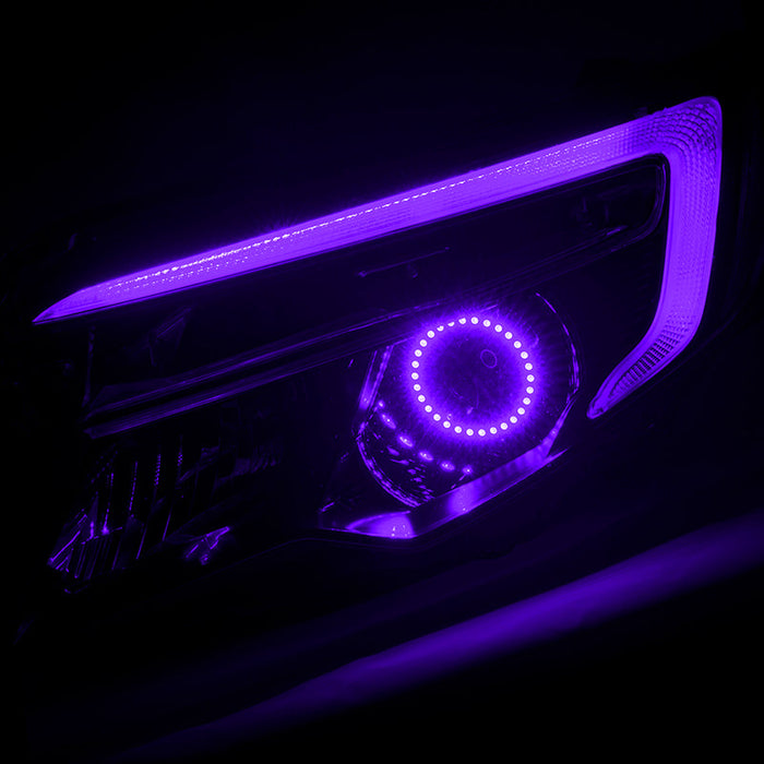 Honda Ridgeline headlight with purple halo and DRL.