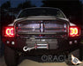 Front end of a Dodge Ram with red LED headlight halo rings installed.