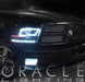 Front end of a black Dodge Ram with white LED headlight and fog light halo rings installed.