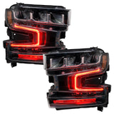 Chevrolet Silverado 1500 headlights with red DRLs.