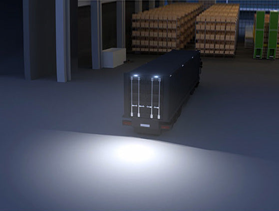 2 Scene Lights installed on a large trailer, illuminating the area behind the trailer.