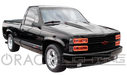 Three quarters view of a truck with red LED headlight halos.