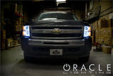 Front view of a Chevrolet Silverado with white LED headlight halo rings installed.