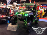 Polaris RZR in a showroom, equipped with green LED headlight halos.