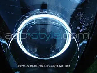 Suzuki Hayabusa headlight unit with white LED halo rings installed.