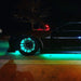 Side view of black Camaro with LED wheel rings and LED underbody kit installed.