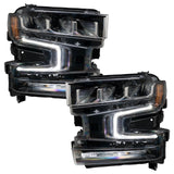 Chevrolet Silverado 1500 headlights with white DRLs.