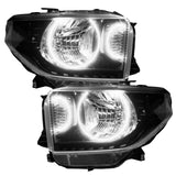 Toyota Tundra headlights with white LED halo rings.