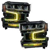 Chevrolet Silverado 1500 headlights with yellow DRLs.