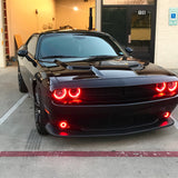 Black challenger parked outside with red halo headlights