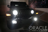 Jeep with bright fog lights in a garage