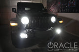 black jeep in garage with LED headlights on