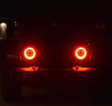 Jeep at night with red halo lights on