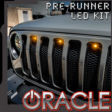 Close-up of pre-runner style LED grill kit installed on Jeep with ORACLE Lighting logo